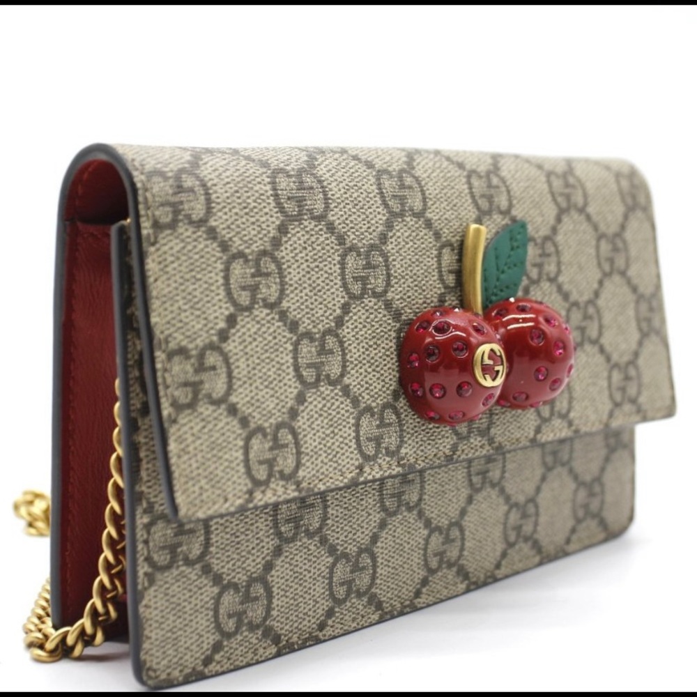 Gucci Cherry 🍒 limited edition cross body wallet on a chain.